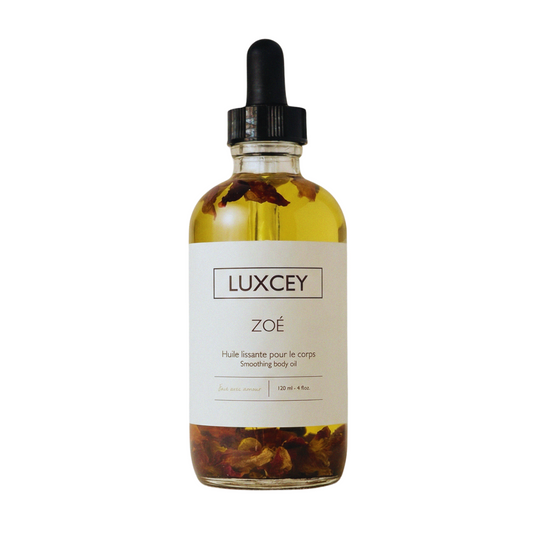 Bottle of Luxcey Zoe body oil on a white background